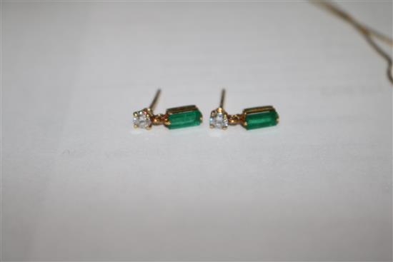 A gold, emerald and diamond pendant on a 14ct gold chain and a pair of similar gold, emerald and diamond ear studs.